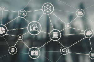 Abstract network diagram with interconnected circular icons representing data analytics, servers, cloud, and other IT elements on a blurred blue background.